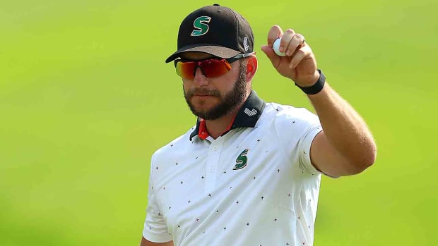 Dean Burmester of South Africa celebrates victory on the 18th green after winning the 2023 Joburg Open in Johannesburg, South Africa.